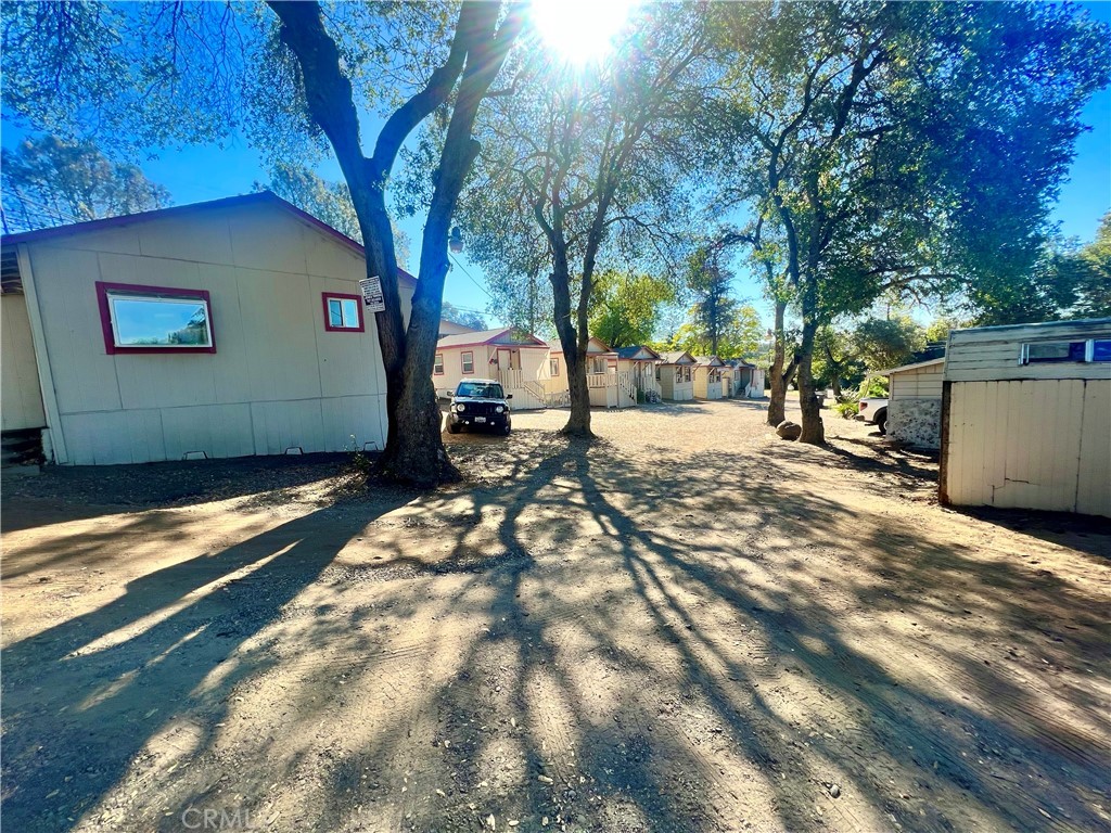13992 Lakeshore Drive Clearlake, CA 95422 - Photo 3 of 35 a backyard of a house with table and chairs