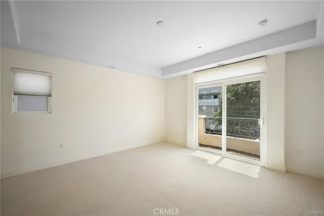 an empty room with glass door