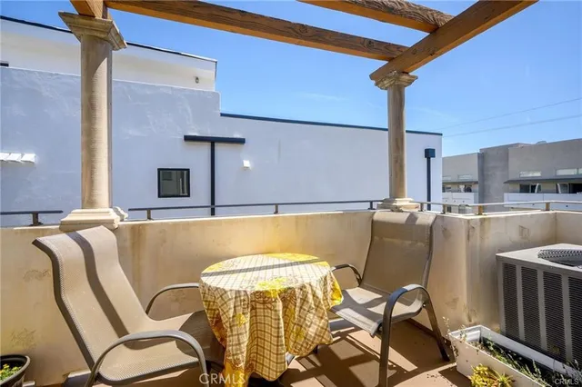 a view of a dining room with furniture and a rug