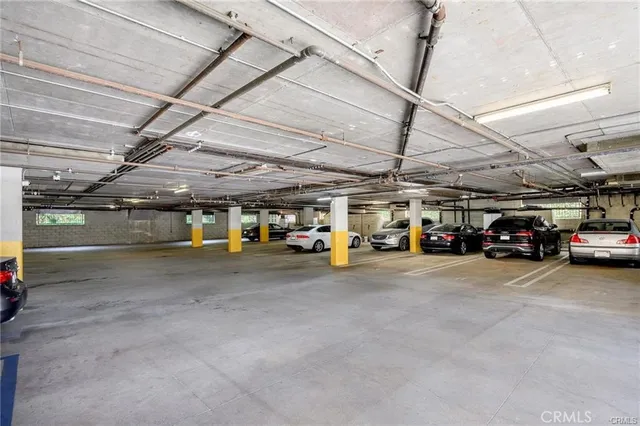a view of parking area with parked cars