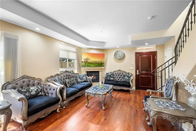 a bedroom with furniture and wooden floor