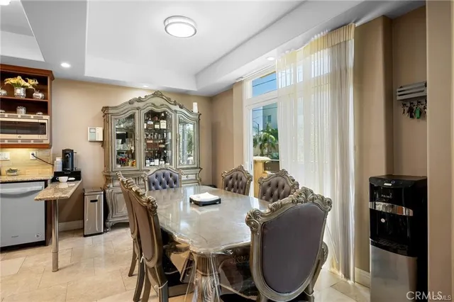 a view of a dining room with furniture and window