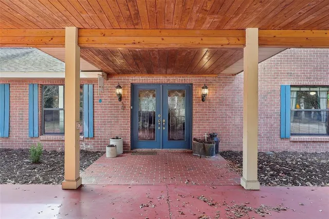 a view of a livingroom with furniture and a window