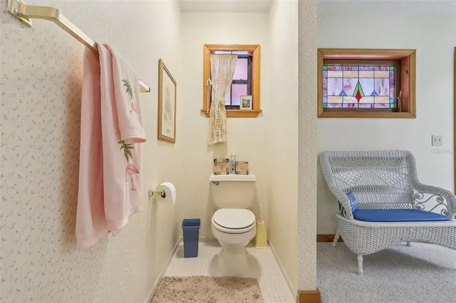 a spacious bathroom with double vanity and a bathtub