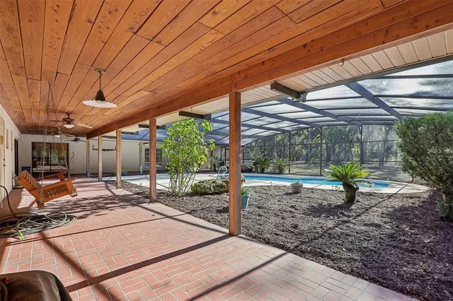 a view of a backyard with sitting area