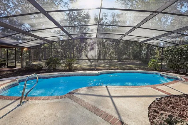 a view of a swimming pool with a patio