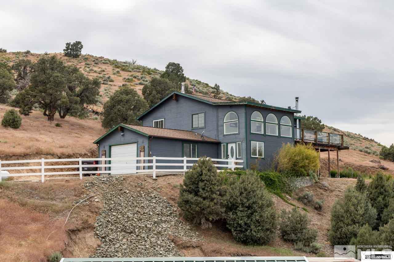 15645 Cheryl Lane Reno, NV 89521 - Photo 1 of 1 a view of house with a yard
