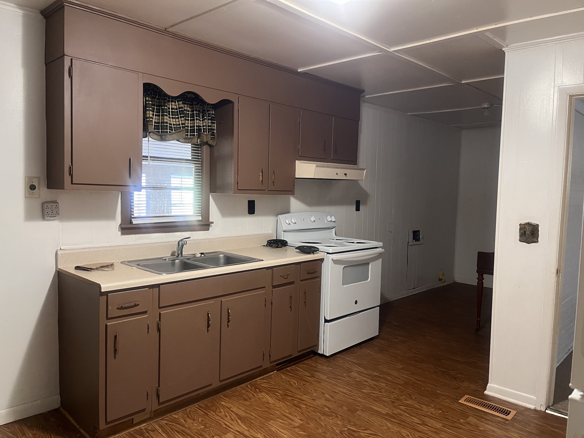 1035 North 3rd Street Pulaski, TN 38478 - Photo 8 of 17 a kitchen with a sink cabinets and window