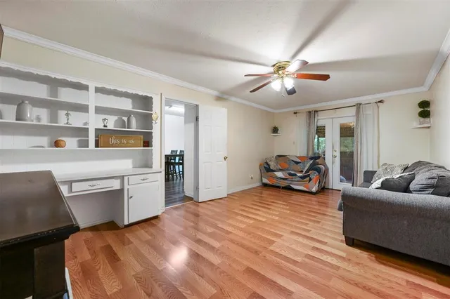 a bedroom with furniture and a chandelier