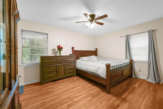 a bedroom with a bed and a dresser