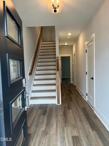 a view of entryway with wooden floor