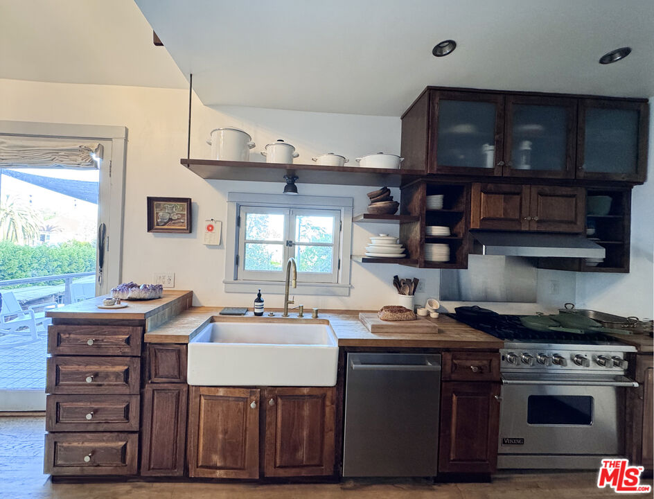 814 East Edgeware Road Los Angeles, CA 90026 - Photo 6 of 33 a kitchen with a stove and a microwave