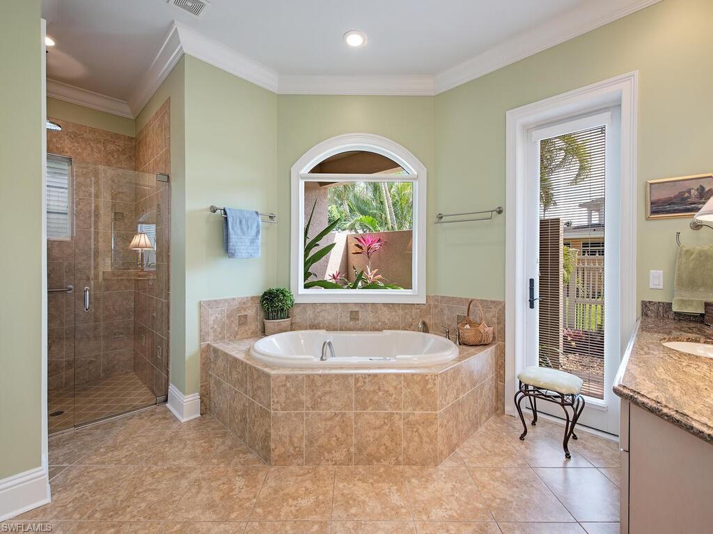 650 Bow Line Drive Naples, FL 34103 - Photo 11 of 18 a living room with a bath tub and shower