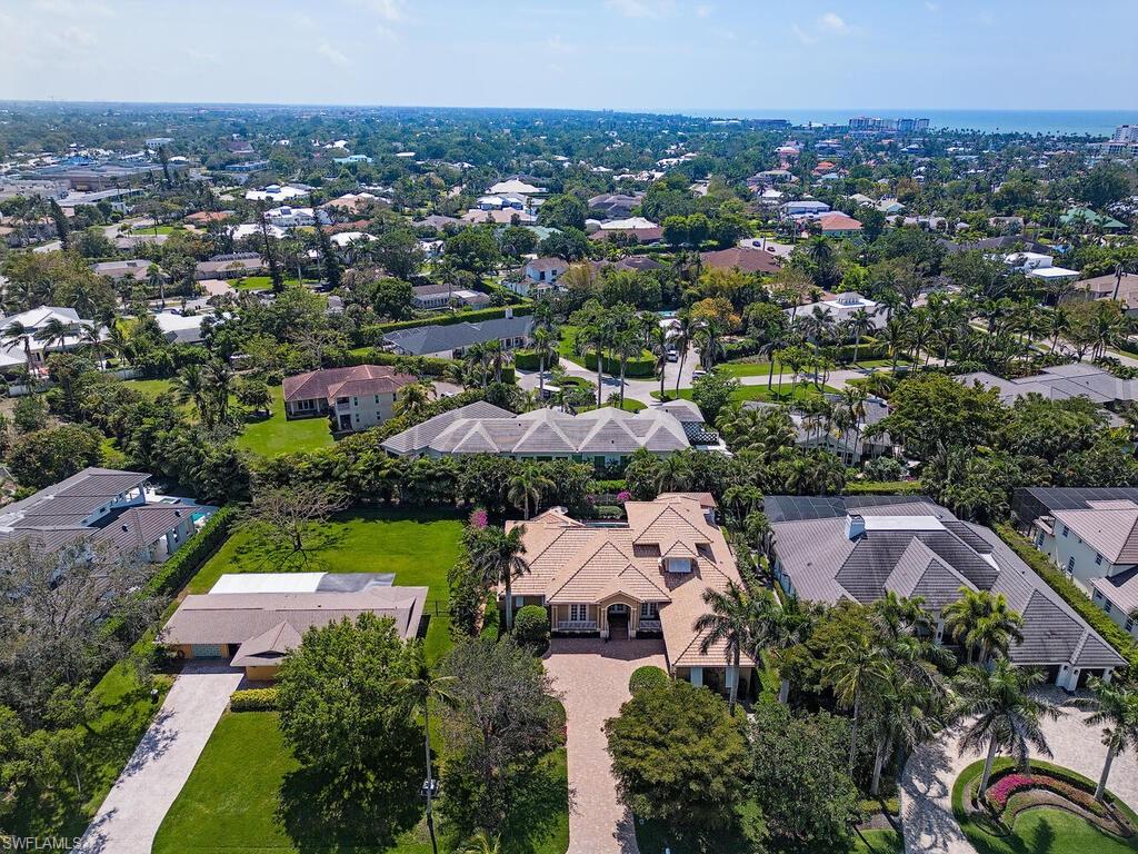 650 Bow Line Drive Naples, FL 34103 - Photo 12 of 18 an aerial view of residential houses with outdoor space and trees