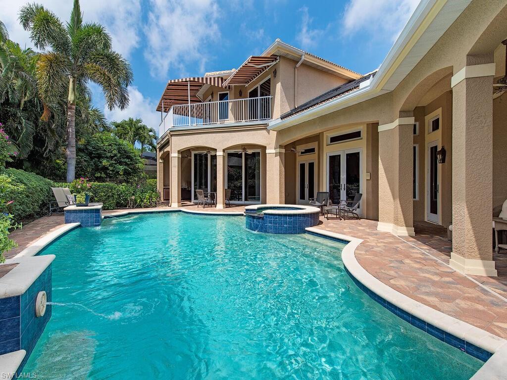 650 Bow Line Drive Naples, FL 34103 - Photo 3 of 18 a front view of a house with garden