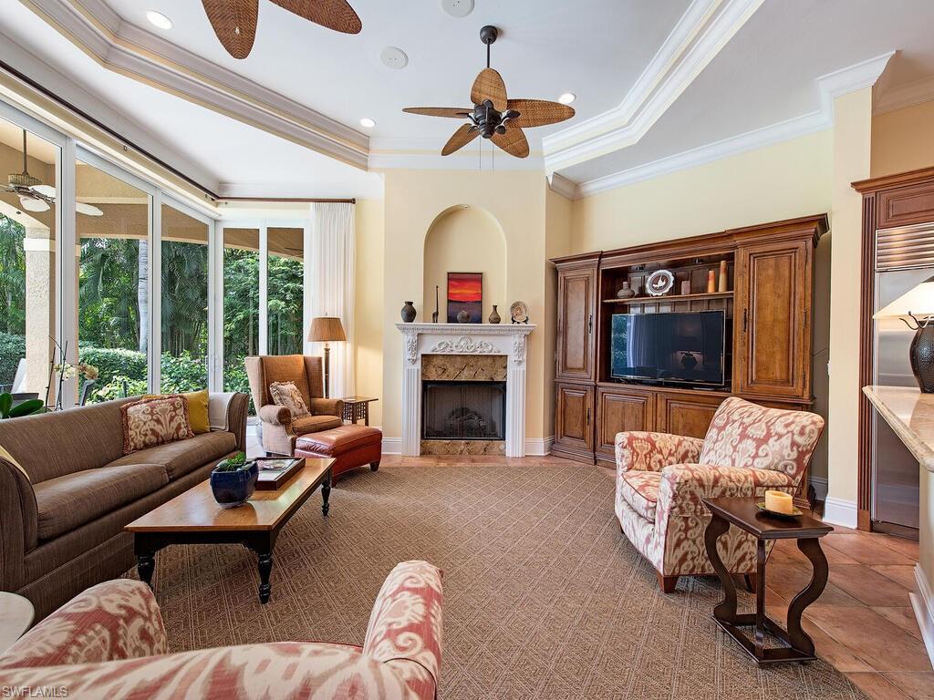 650 Bow Line Drive Naples, FL 34103 - Photo 4 of 18 a living room with furniture and a fireplace