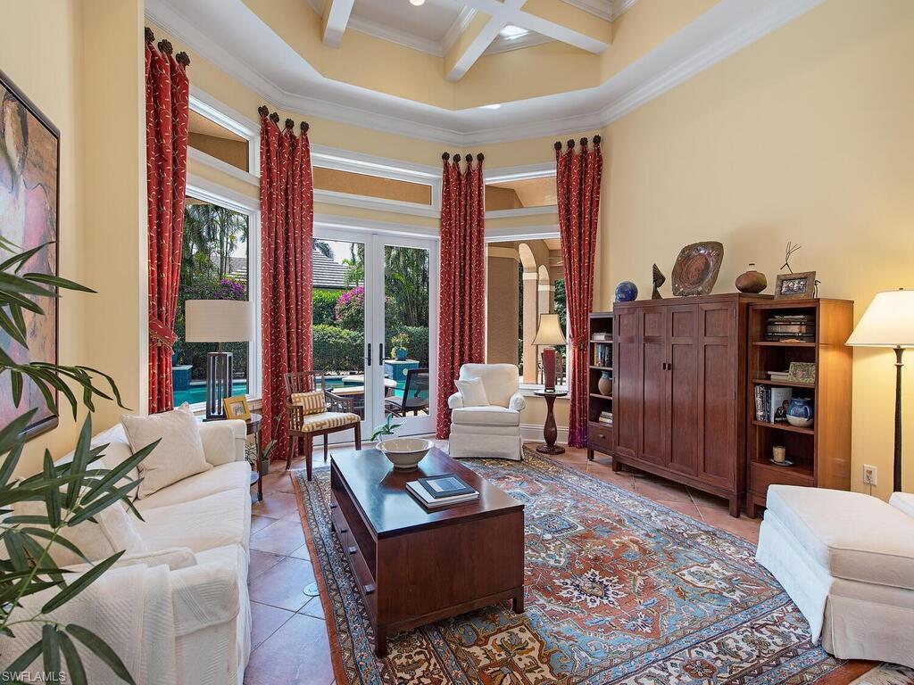 650 Bow Line Drive Naples, FL 34103 - Photo 7 of 18 a living room with furniture and large windows