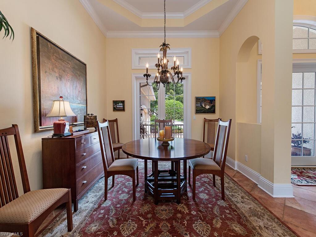 650 Bow Line Drive Naples, FL 34103 - Photo 8 of 18 a view of a dining room with furniture window and wooden floor