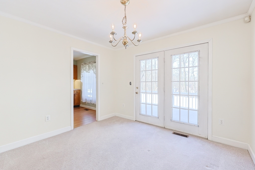 17 Quisset Brook Road, Unit 17 Milton, MA 02186 - Photo 20 of 40 a view of an empty room with a window