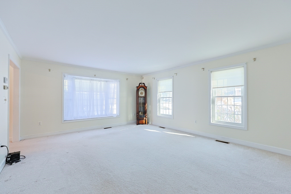 17 Quisset Brook Road, Unit 17 Milton, MA 02186 - Photo 25 of 40 an empty room with windows