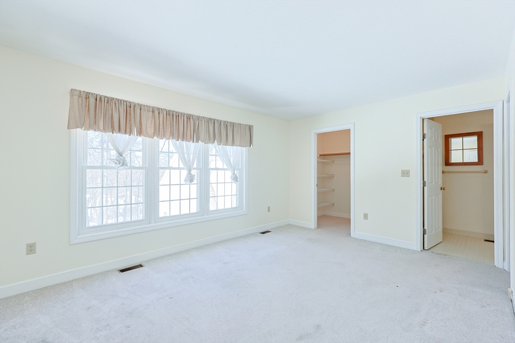 17 Quisset Brook Road, Unit 17 Milton, MA 02186 - Photo 28 of 40 an empty room with windows
