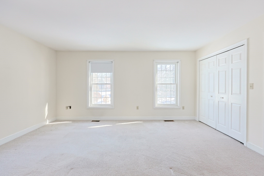17 Quisset Brook Road, Unit 17 Milton, MA 02186 - Photo 33 of 40 an empty room with windows