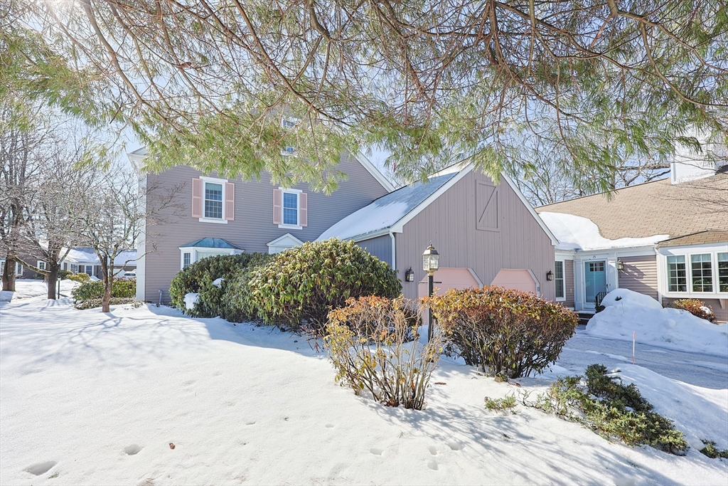 17 Quisset Brook Road, Unit 17 Milton, MA 02186 - Photo 37 of 40 a view of a house with a yard covered in snow