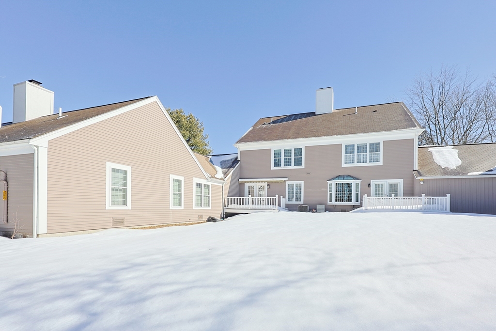 17 Quisset Brook Road, Unit 17 Milton, MA 02186 - Photo 39 of 40 a front view of a house with a yard