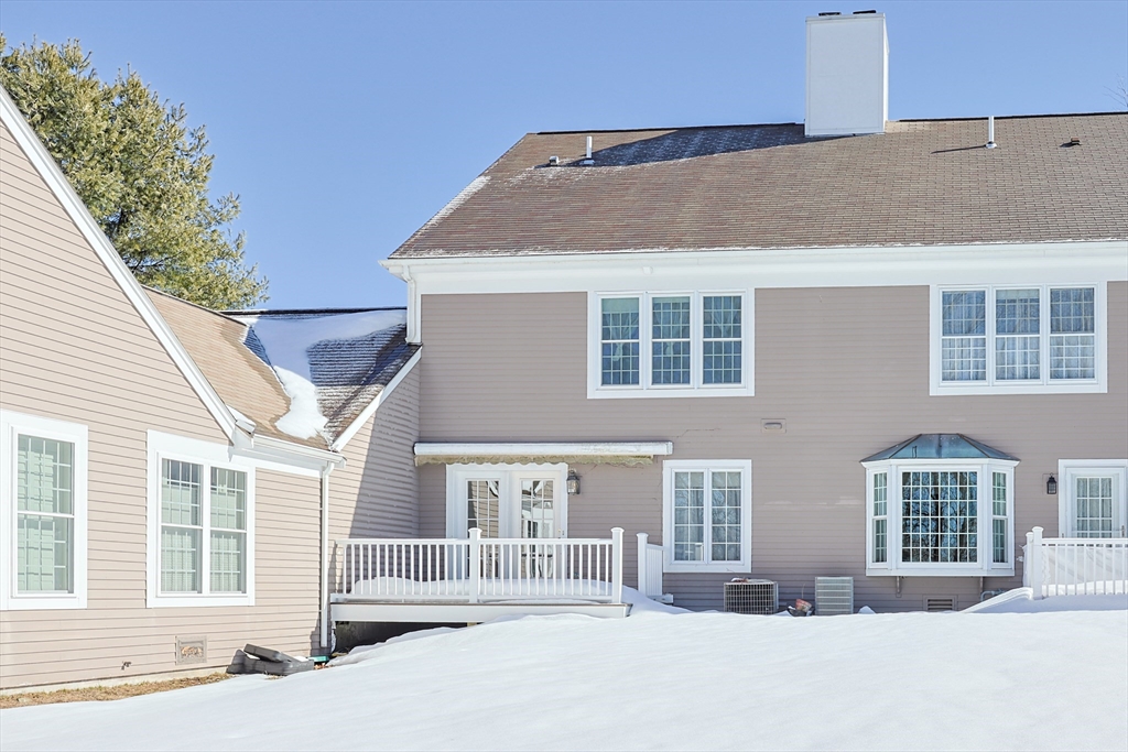 17 Quisset Brook Road, Unit 17 Milton, MA 02186 - Photo 40 of 40 a front view of a house with a outdoor space