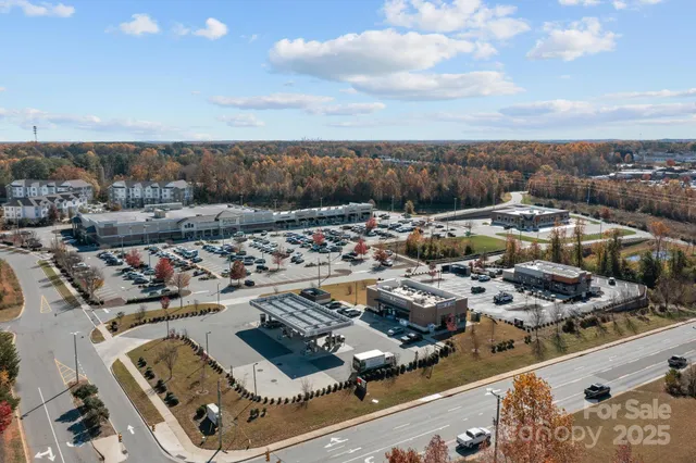 a man walking down a street next to a building