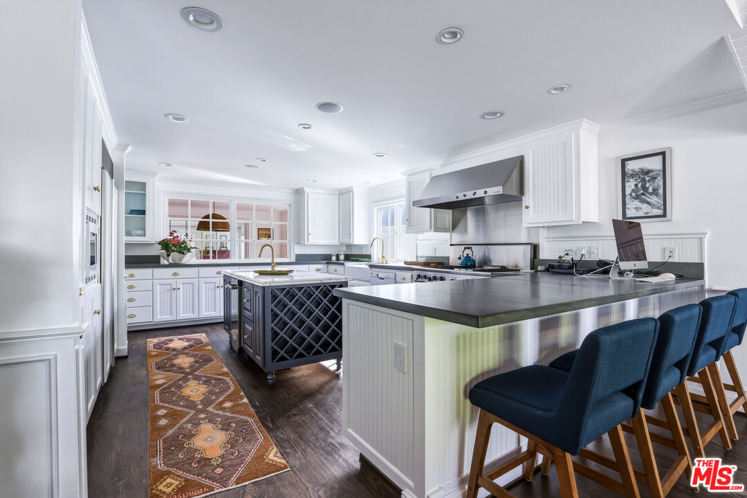 30810 Broad Beach Road Malibu, CA 90265 - Photo 14 of 55 a kitchen with granite countertop lots of counter top space and stainless steel appliances