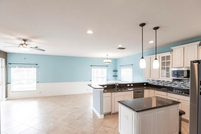 a kitchen with a sink and cabinets