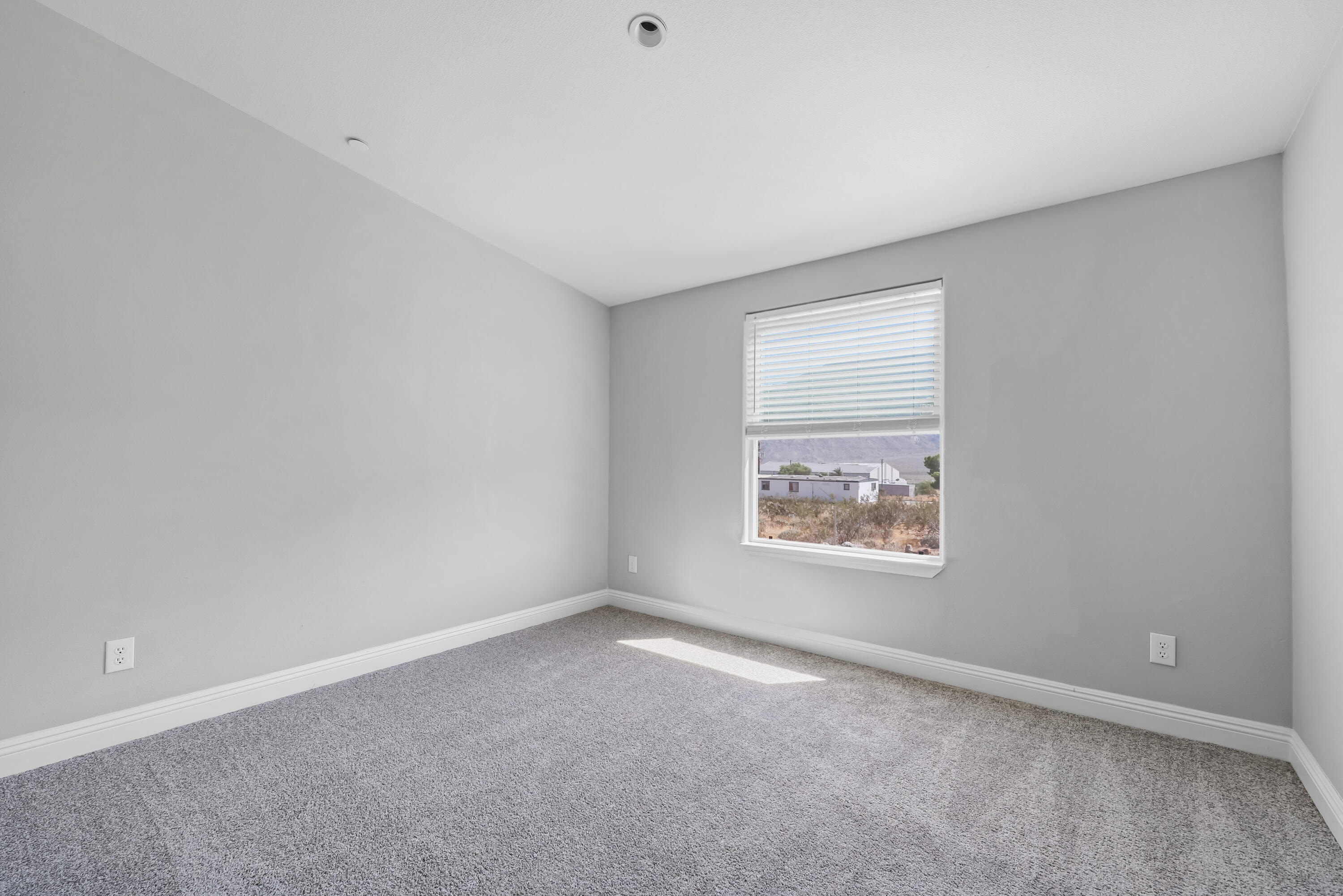 13446 Cholla Road Whitewater, CA 92282 - Photo 13 of 30 an empty room with a window