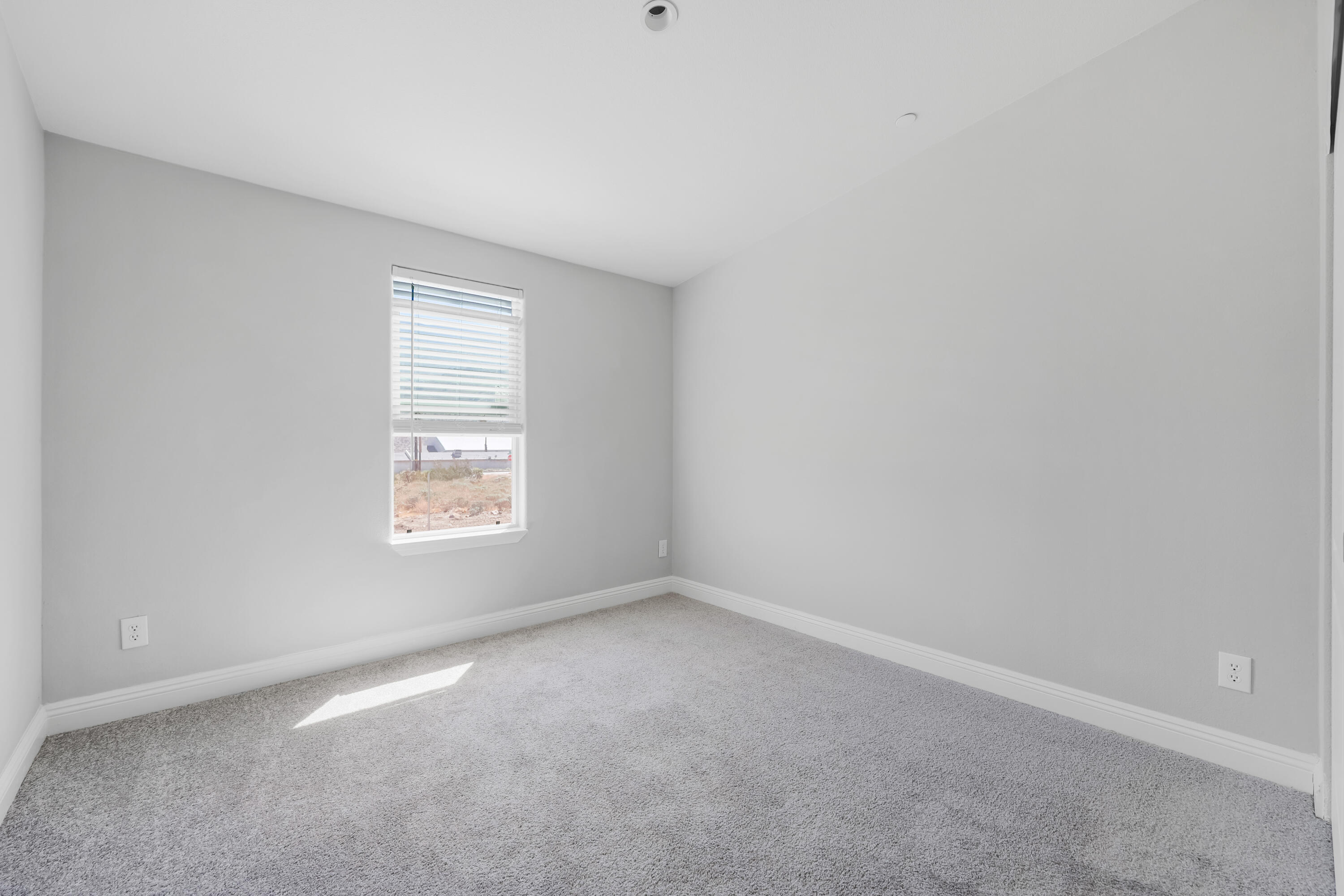 13446 Cholla Road Whitewater, CA 92282 - Photo 15 of 30 an empty room with a window