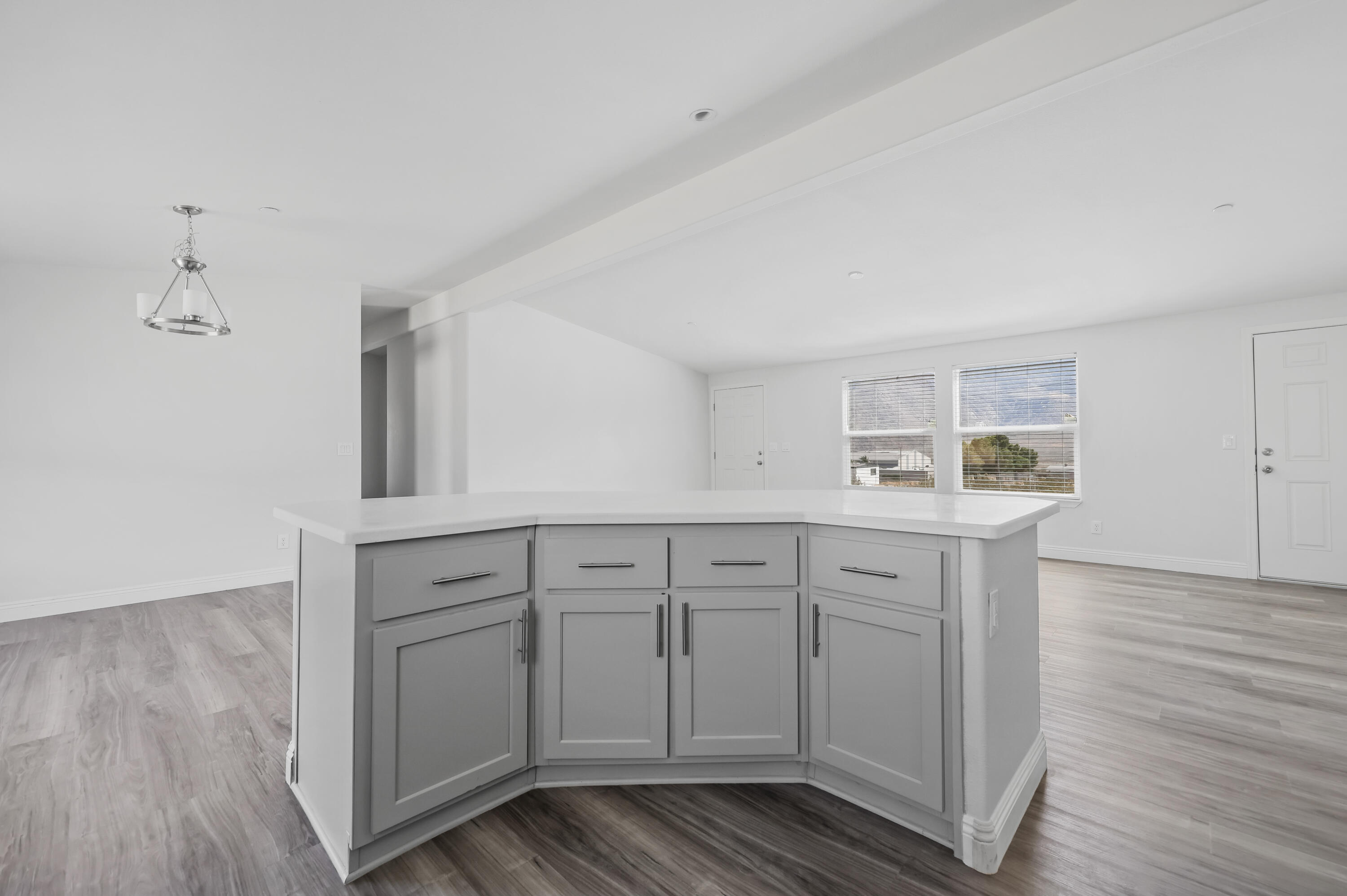 13446 Cholla Road Whitewater, CA 92282 - Photo 3 of 30 a kitchen with sink cabinets and wooden floor