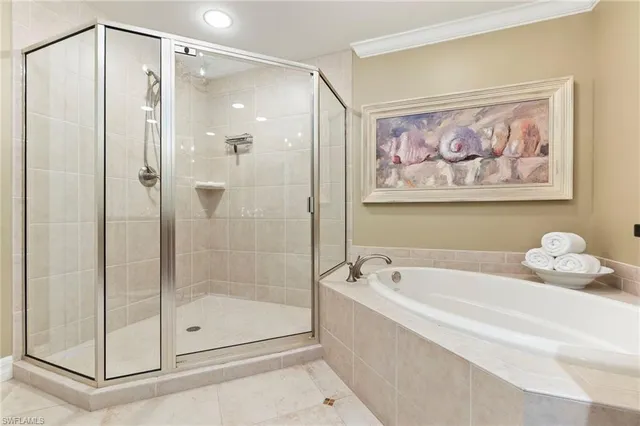 a bathroom with a bathtub and shower