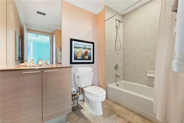 a bathroom with a toilet a sink and bathtub