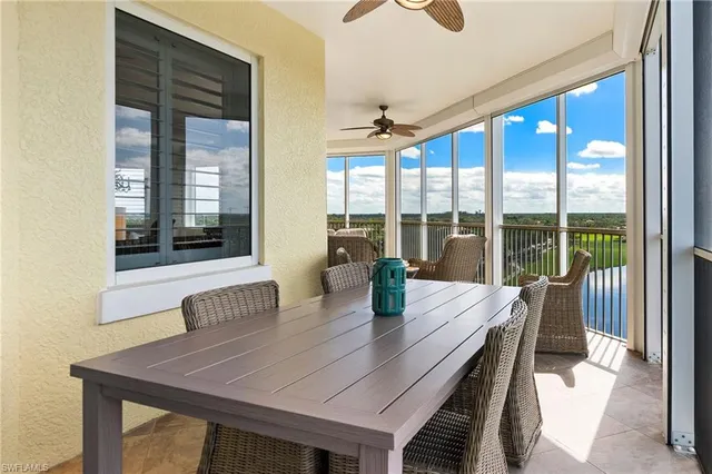 a view of a dining room with furniture and window