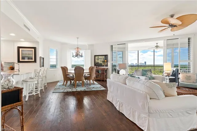 a living room with fireplace furniture and a wooden floor