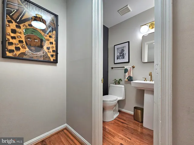 a bathroom with a toilet and a sink