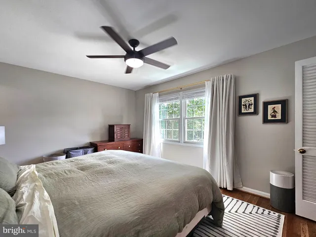 a bedroom with a large bed and a window
