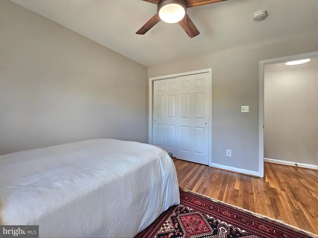 a bed room with a bed and a chandelier
