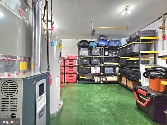 a view of a bedroom with that has a bed and a bookshelf