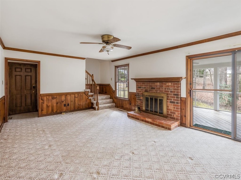 1106 Royal Ridge Road Midlothian, VA 23114 - Photo 12 of 34 a view of a livingroom with a fireplace a ceiling fan and windows