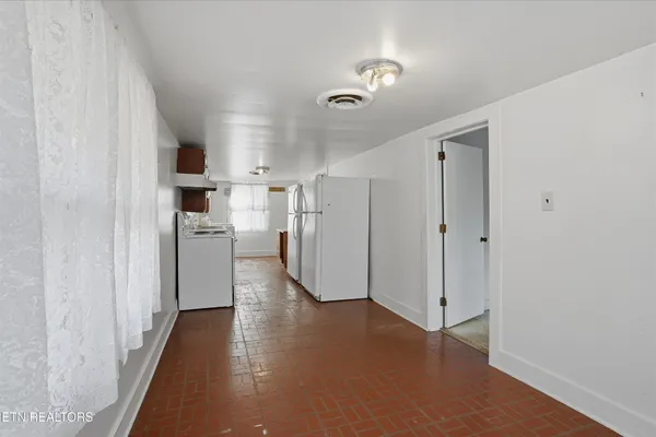 a kitchen with stainless steel appliances a stove a refrigerator and a sink