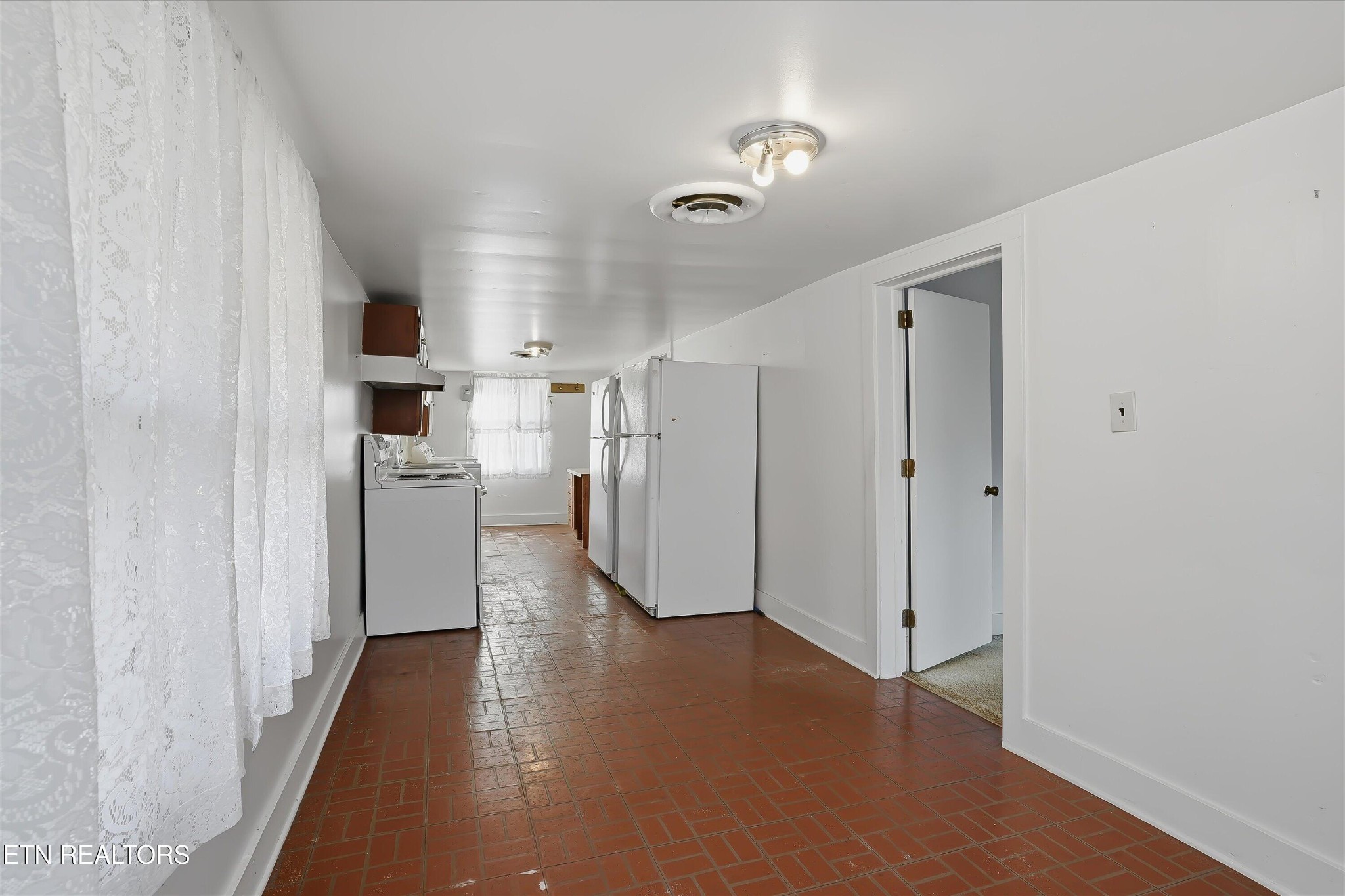 7809 Wood Road Corryton, TN 37721 - Photo 15 of 51 a view of a kitchen with refrigerator and wooden floor