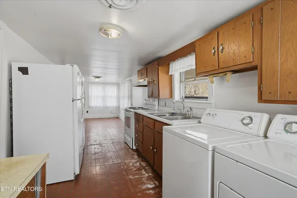 a utility room with dryer and washer