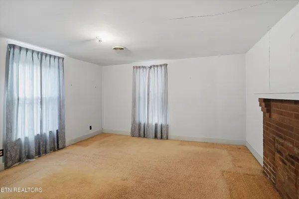 a view of an empty room and closet