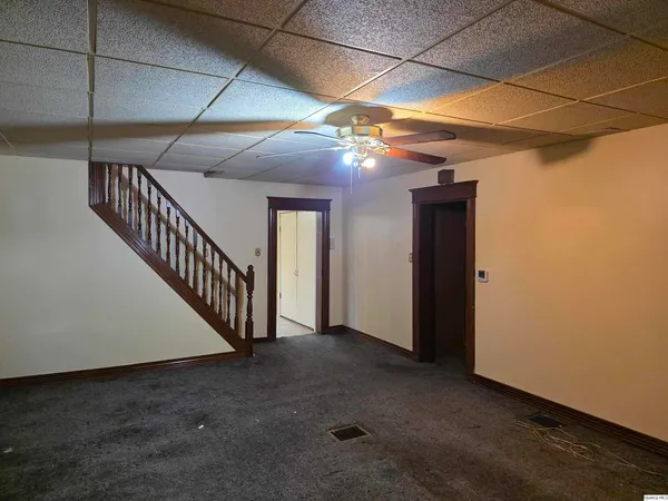 a view of a hallway with stairs
