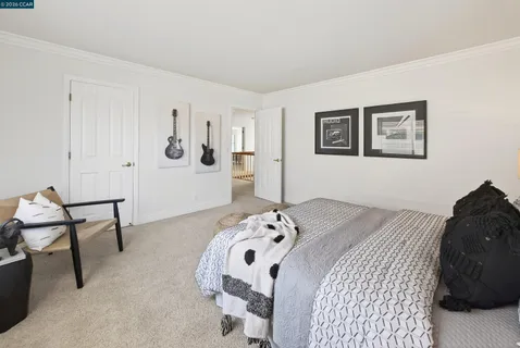 a utility room with cabinets washer and dryer